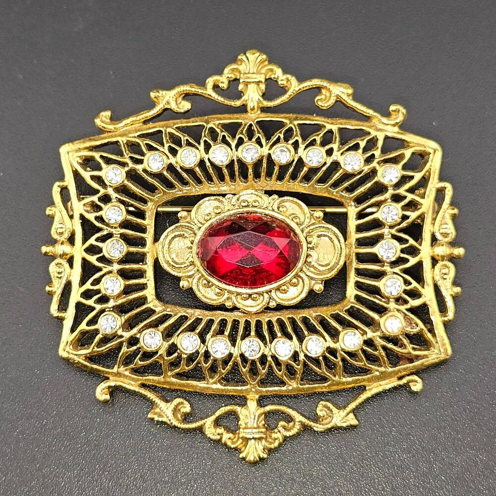 Vintage 1928 Brand Red White Rhinestone Gold Tone Filigree Brooch Pin 2.25"